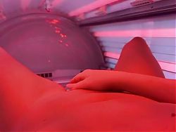 German milf in sun bed uses fingers 